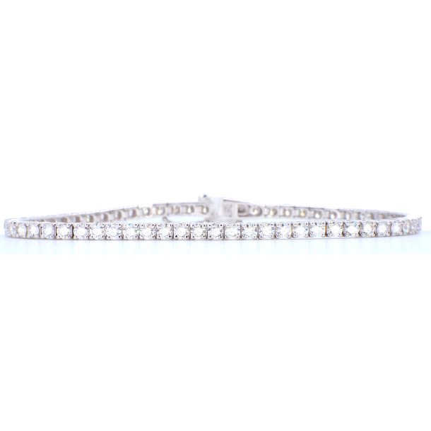 TENNISARMB�ND i 18 kt guld &amp; 5.00 ct. diamanter
